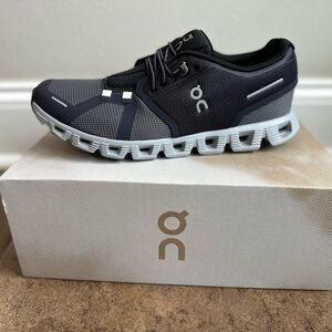 On Running Black and Gray Athletic Shoes with Cloud-Tec Innovation